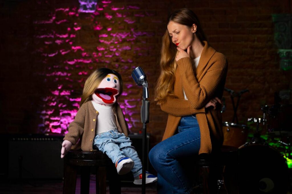 Comedian performing on stage, engaging the audience with humor, storytelling, and expressive delivery.